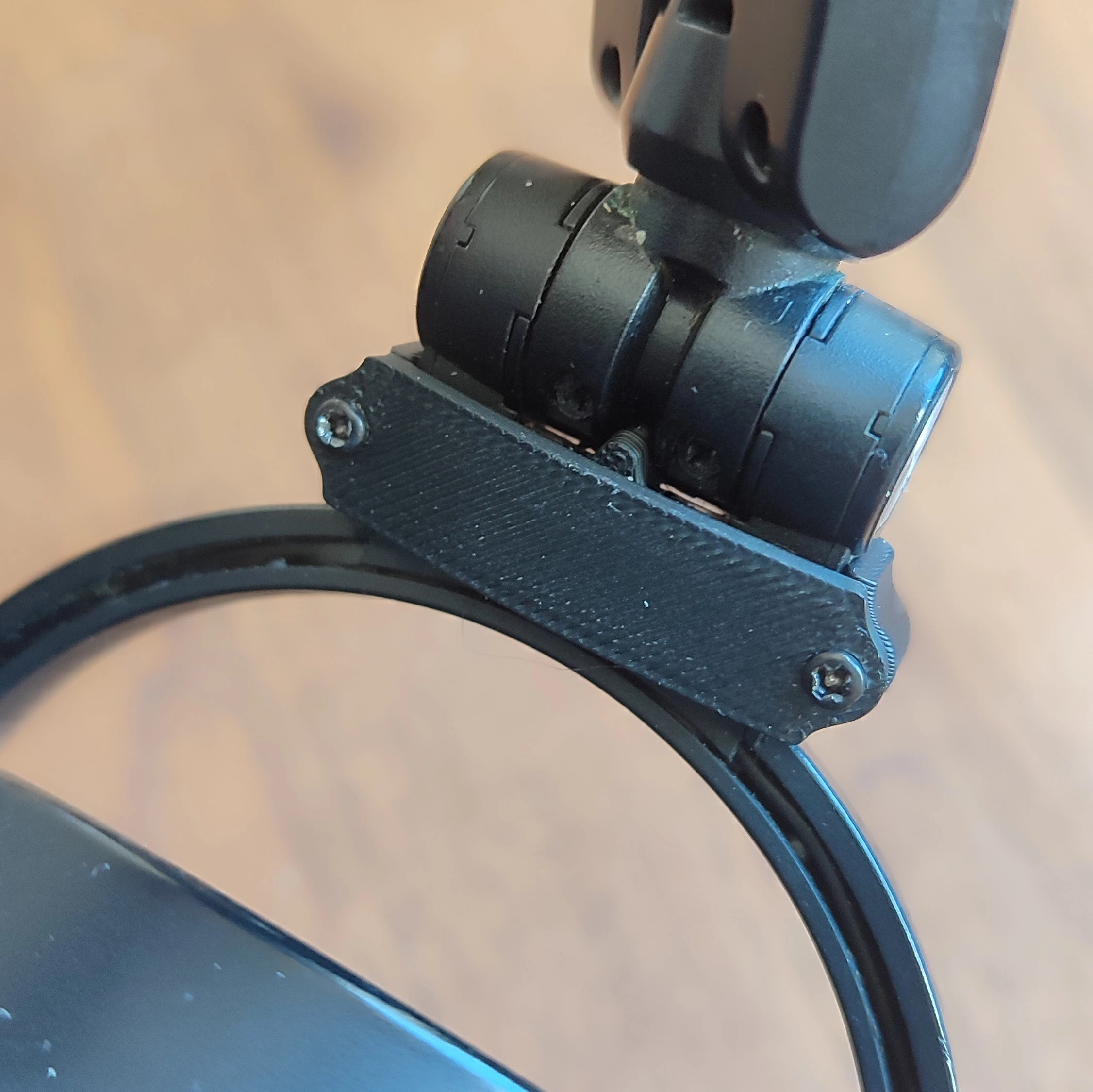 The brace and the backing plate screwed together through the arm